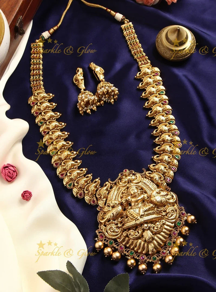 Gold alike Elegant Krishna playing flute and Peacock carved haram - Sparkle and Glow