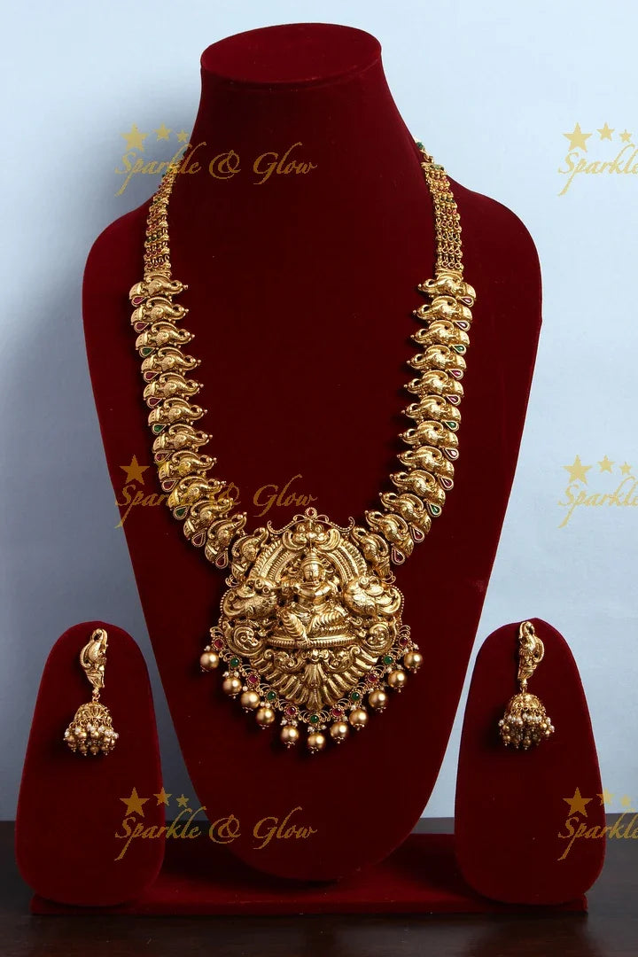 Gold alike Elegant Krishna playing flute and Peacock carved haram - Sparkle and Glow