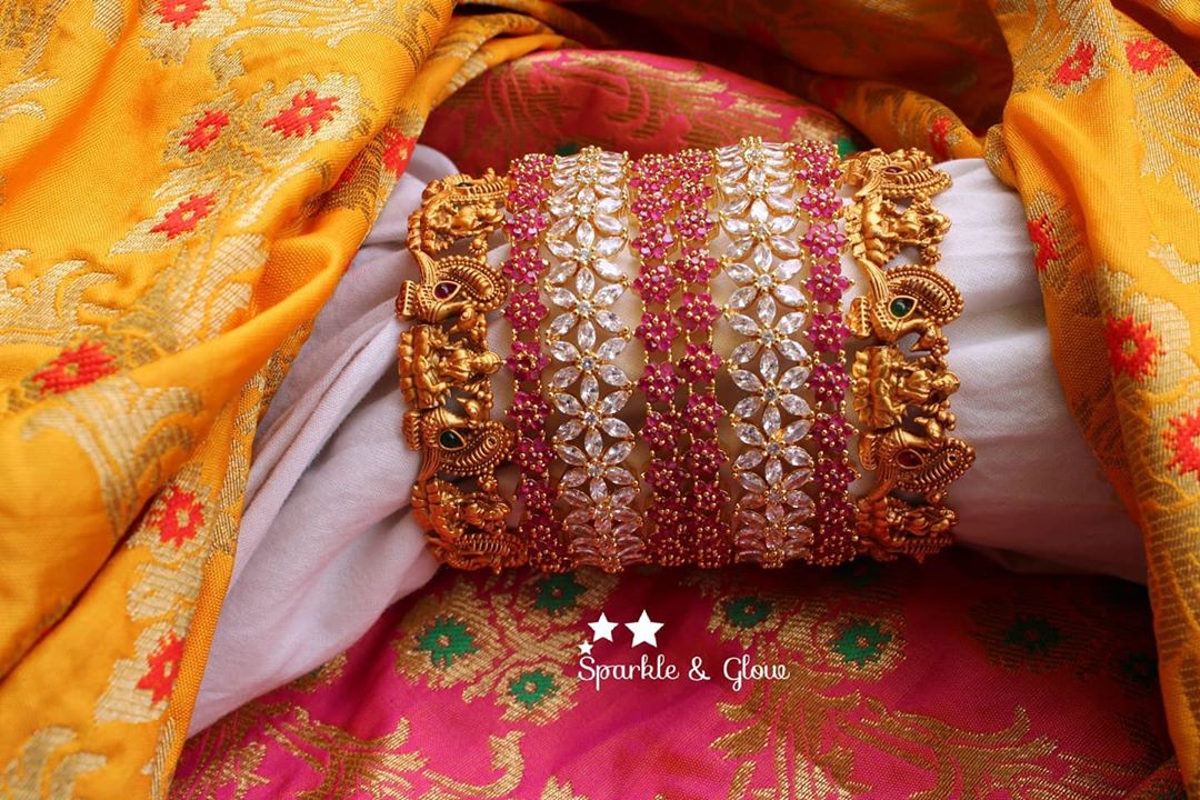 Corner Matte Gold Peacock and Lakshmi carved bangles