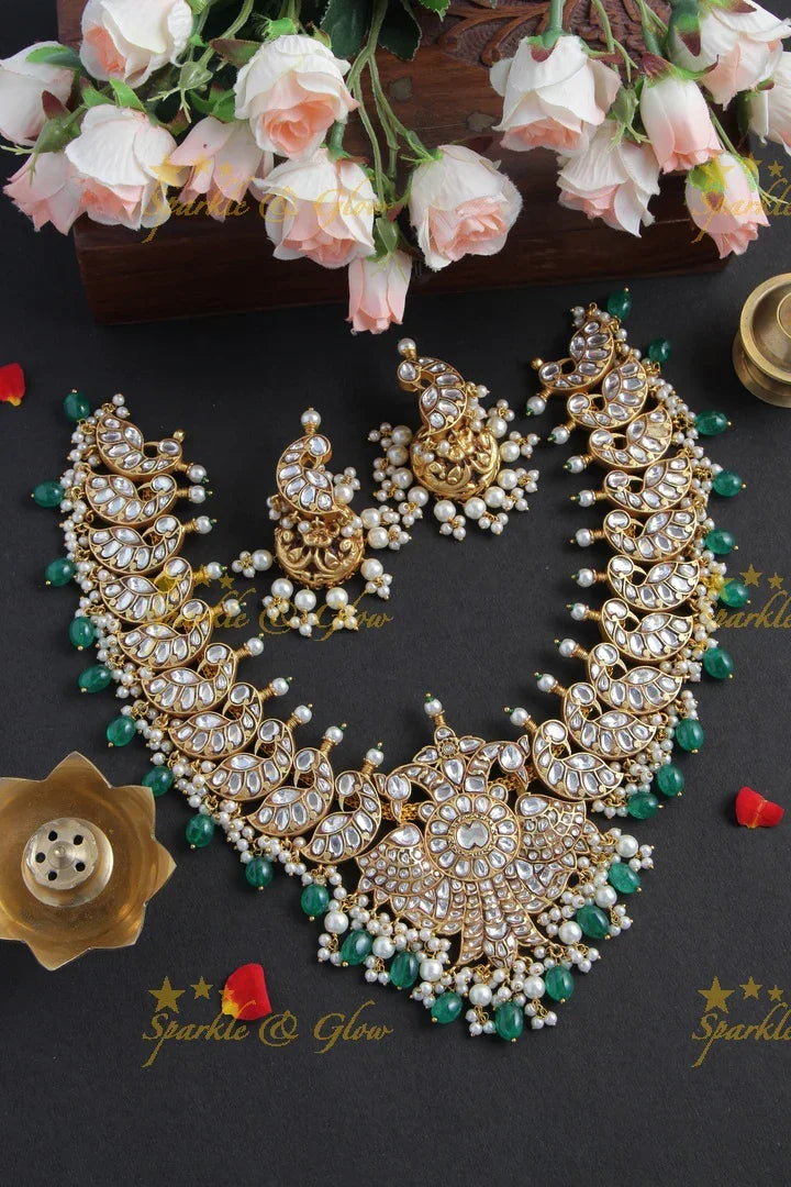 Intricately Craved Peacock Necklace with Green Beads - Sparkle and Glow