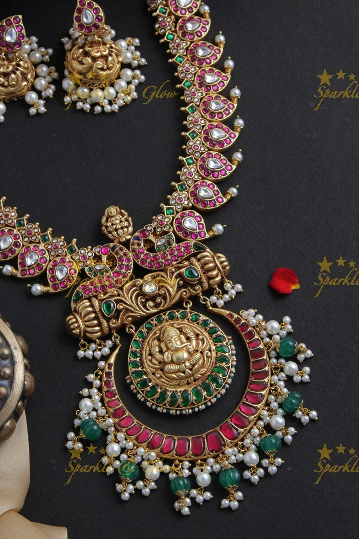 Intricately Craved Mango Peacock Necklace with Ganesh Pendent - Sparkle and Glow