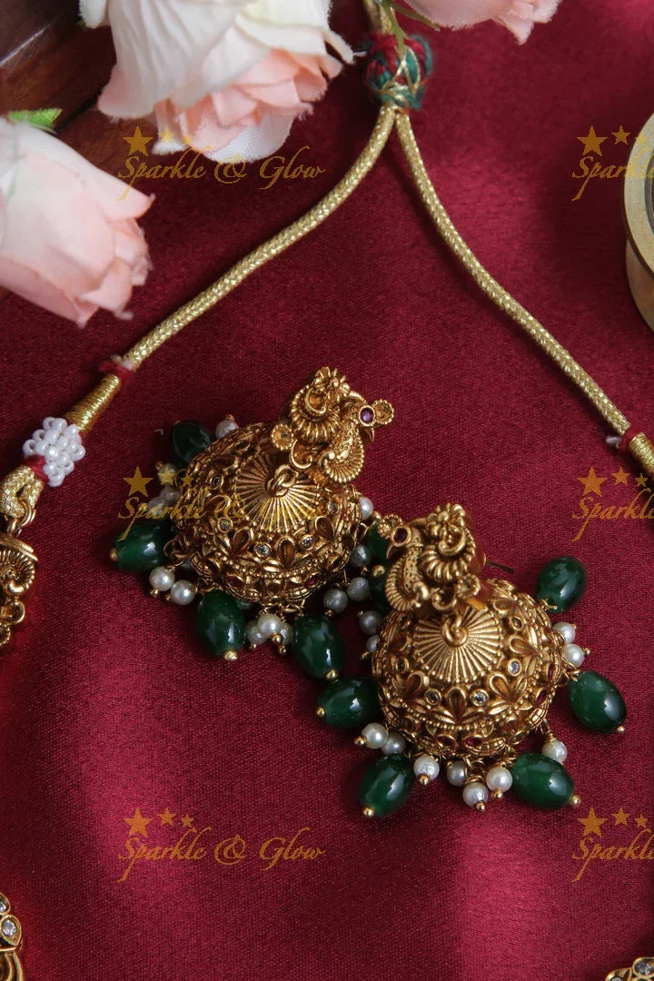 Intricately Carved Gold Alike Polished Lakshmi Elephant Short Necklace With Green Beads - Sparkle and Glow