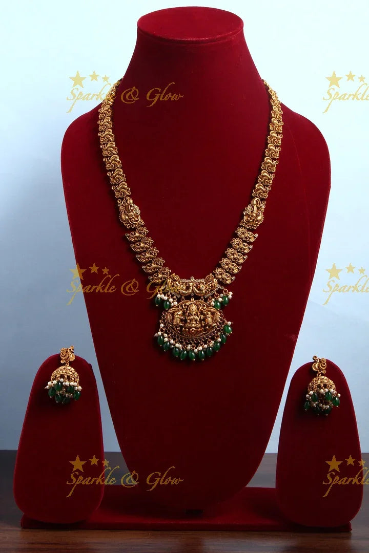 Intricately Carved Gold Alike Polished Lakshmi Elephant Long Necklace With Green Beads - Sparkle and Glow