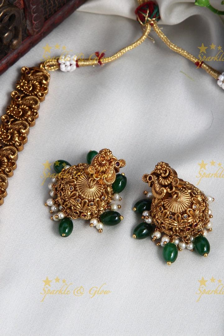 Intricately Carved Gold Alike Polished Lakshmi Elephant Long Necklace With Green Beads - Sparkle and Glow