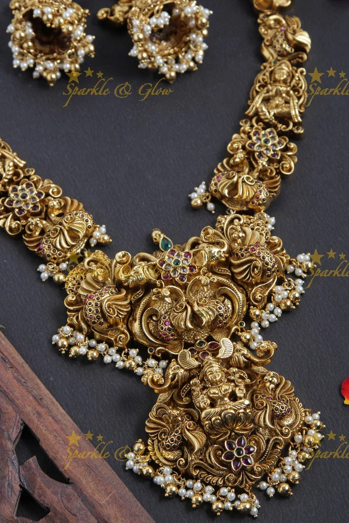 Intricately Carved Gold Alike Polished Peacock Lakshmi Gutta Pusalu Haram - Sparkle and Glow