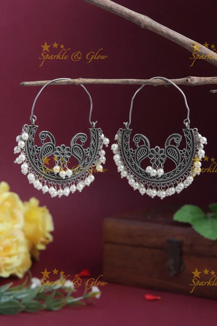 Intricately carved peacock floral chandbalis - Sparkle and Glow