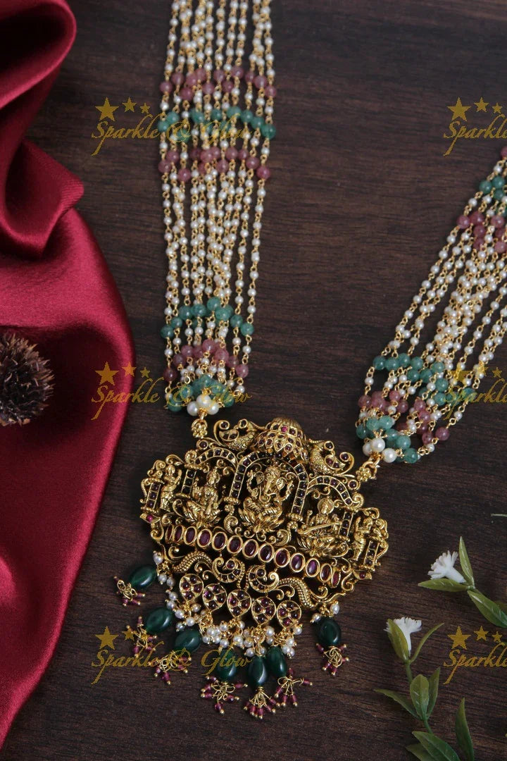 Multilayered pink green beads pearl haram with beautiful Gold alike Lakshmi Ganesha Saraswathi carved pendent - Sparkle and Glow