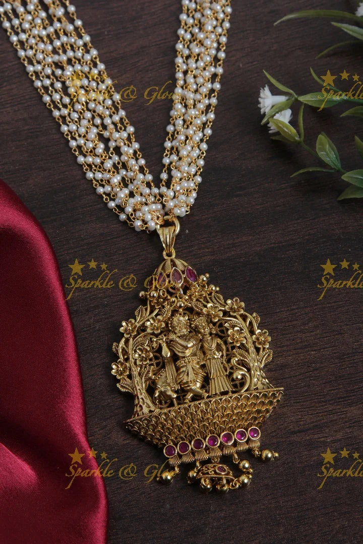 Multilayered Pearl Haram with beautiful Lord Radha Krishan Plaing flute pendent - Sparkle and Glow