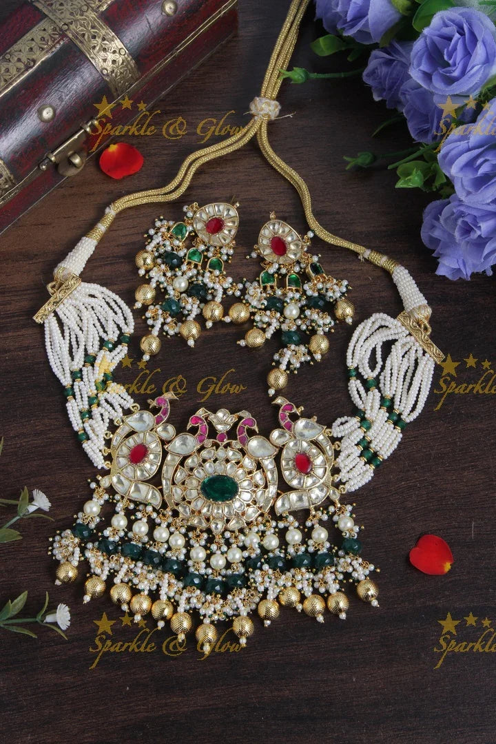 Intricately carved Jadau Kundan peacock pendent pearl choker - Sparkle and Glow