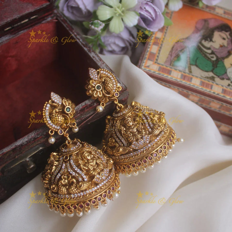 Beautiful peacock studded lakshmi carved heavy jhumkas - Sparkle and Glow