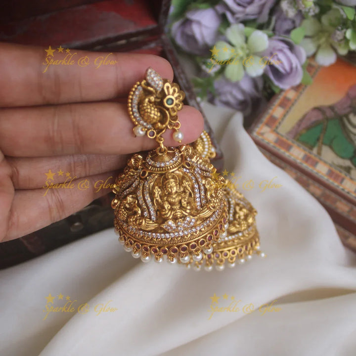 Beautiful peacock studded lakshmi carved heavy jhumkas - Sparkle and Glow