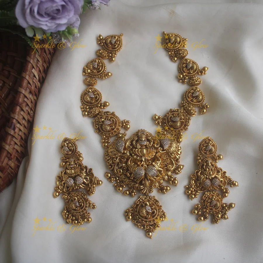 Gold alike peacock carved Lakshmi short necklace with statement earrings - Sparkle and Glow