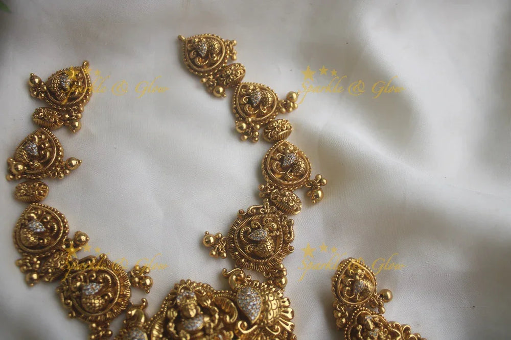 Gold alike peacock carved Lakshmi short necklace with statement earrings - Sparkle and Glow