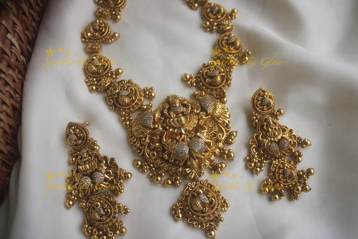 Gold alike peacock carved Lakshmi short necklace with statement earrings - Sparkle and Glow