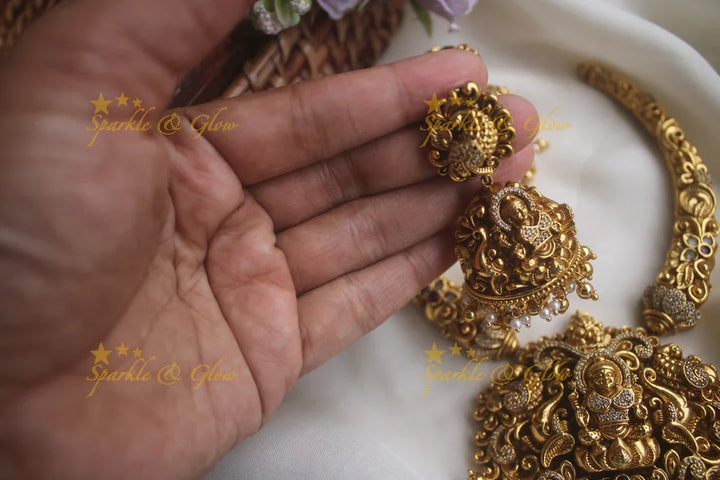 Intricate gold alike pipe necklace with elephant lakshmi carved pendent - Sparkle and Glow