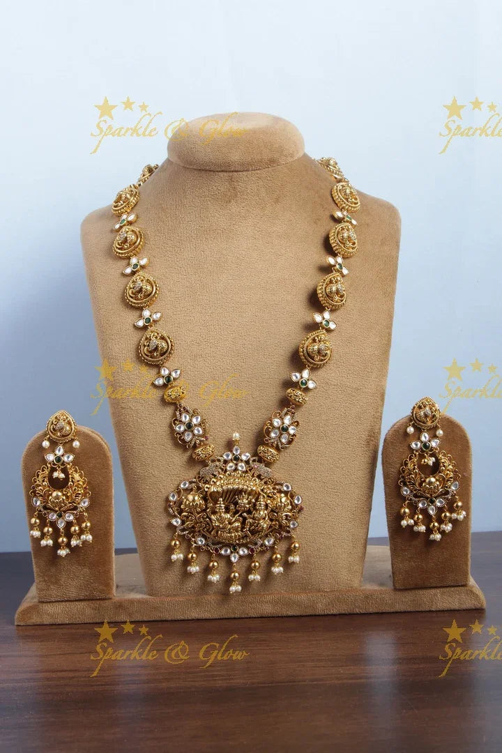 Elegant Seshashayana carved pendent peacock haram with kundan stones - Sparkle and Glow