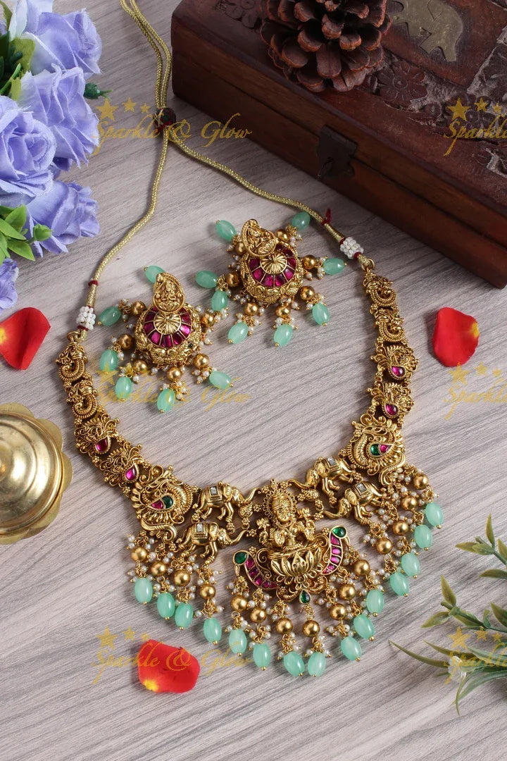 Gold alike jadau lakshmi elephant carved mint green bead necklace - Sparkle and Glow