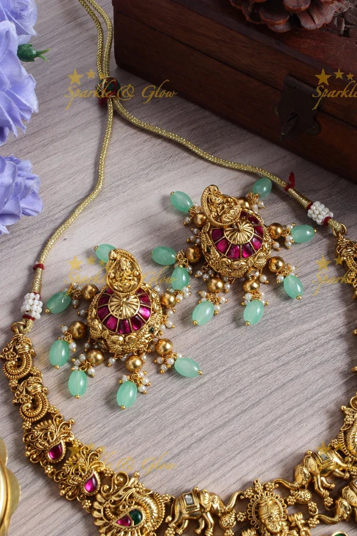 Gold alike jadau lakshmi elephant carved mint green bead necklace - Sparkle and Glow