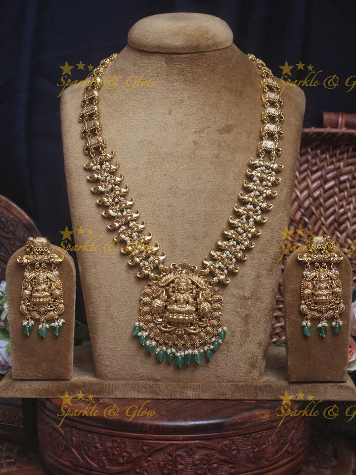 Gold alike Lakshmi Elegant haram with green beads - Sparkle and Glow