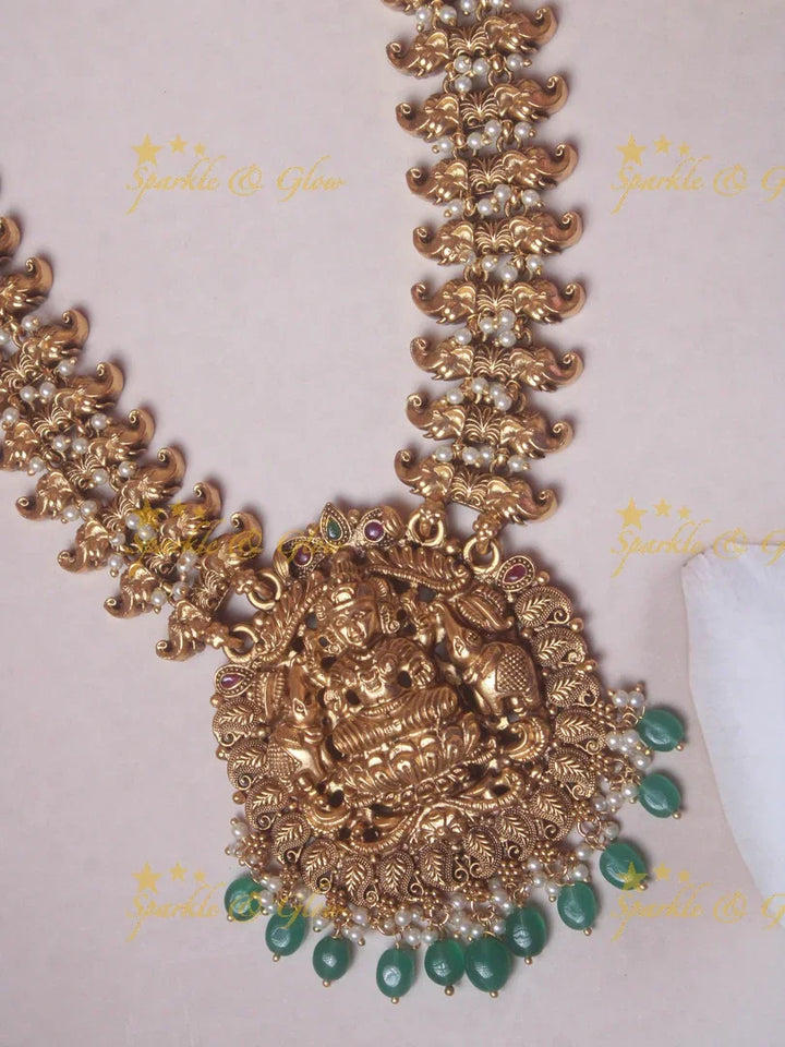 Gold alike Lakshmi Elegant haram with green beads - Sparkle and Glow