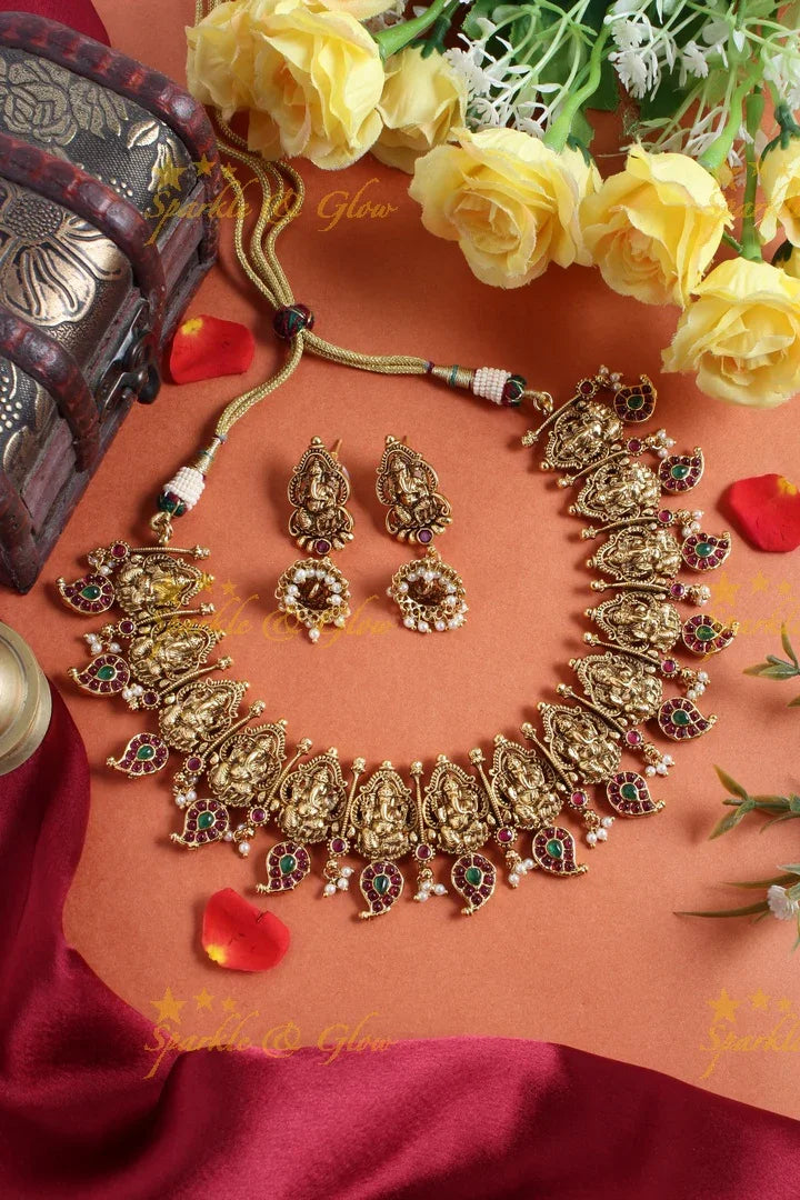 Intricately carved ganesh mango necklace with pearls - Sparkle and Glow
