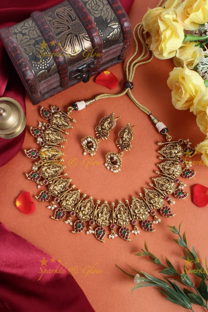 Intricately carved ganesh mango necklace with pearls - Sparkle and Glow