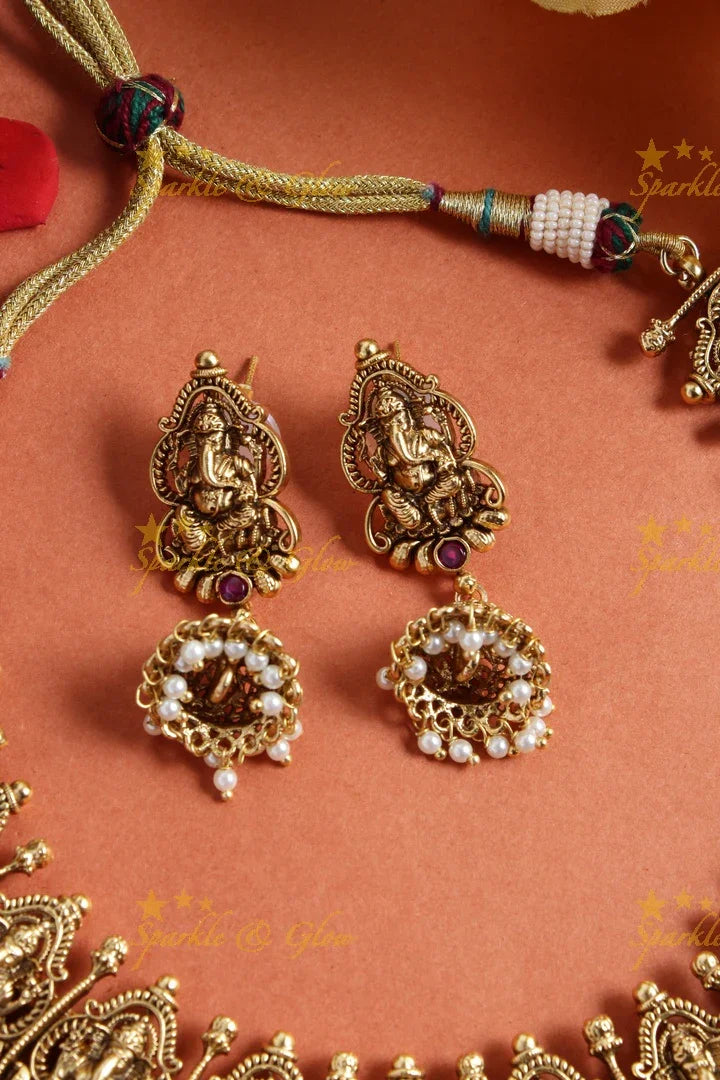 Intricately carved ganesh mango necklace with pearls - Sparkle and Glow