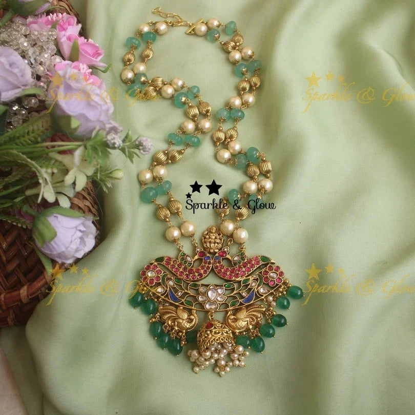 Beautiful pumpkin beads Jadau Lakshmi pendent chain with Lotus and peacock design - Sparkle and Glow