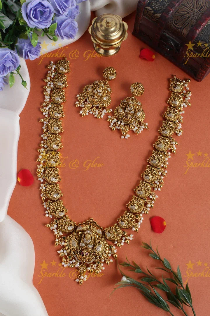 Gold alike long peacock necklace with lakshmi carved pendent - Sparkle and Glow