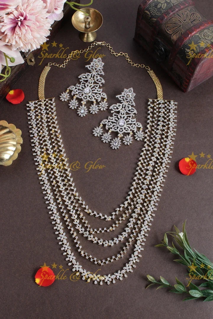 GJ polish multilayered AD leaf design necklace with jhumkas - Sparkle and Glow