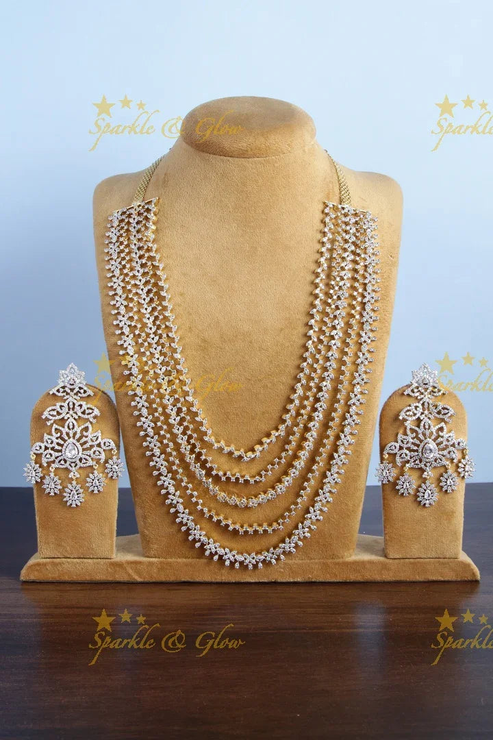 GJ polish multilayered AD leaf design necklace with jhumkas - Sparkle and Glow