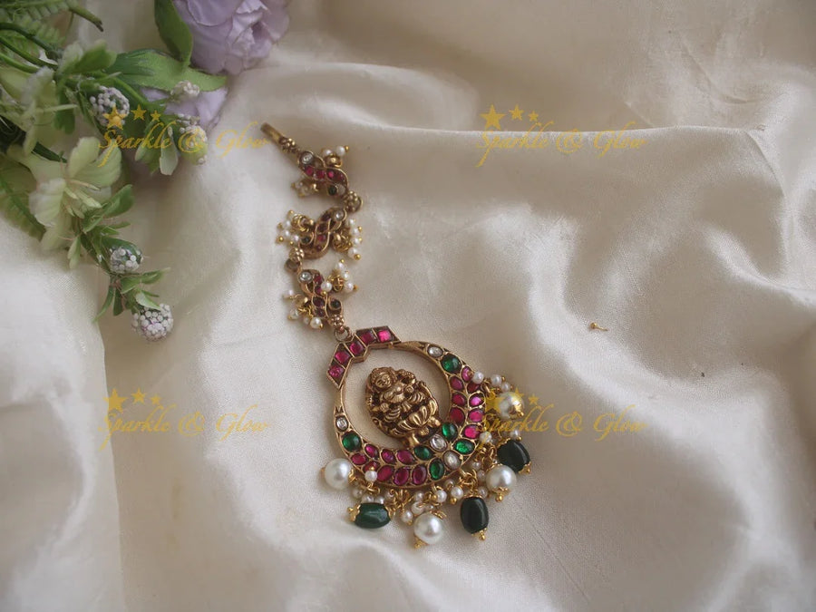 Beautiful antique Lakshmi and peacock Jadau maang tikka with pearl green beads - Sparkle and Glow