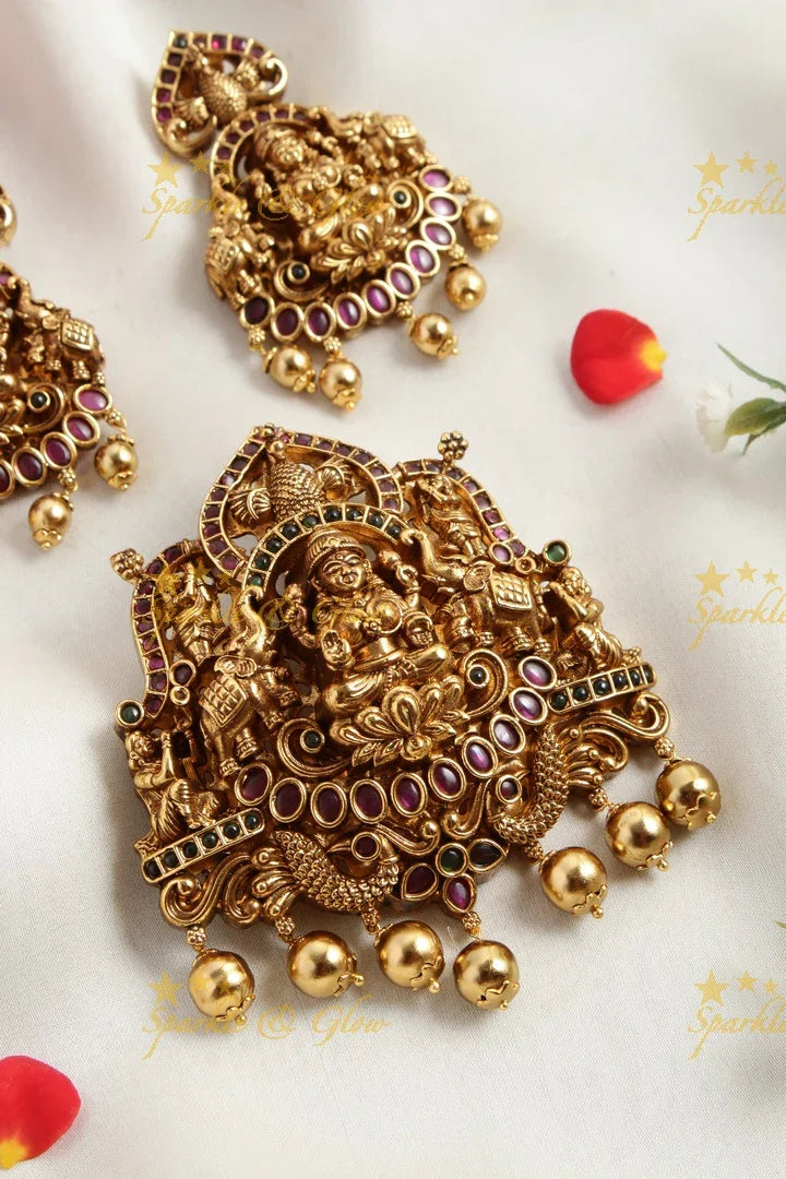 Gold alike Elegant Lakshmi carved pendent set with green pink stones - Sparkle and Glow