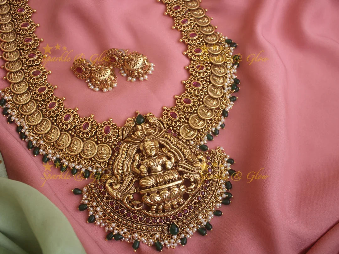 Grand Intricate gold alike Lakshmi coin Haram with red stones and green beads - Sparkle and Glow