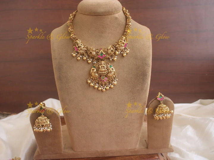 Statement Lakshmi and peacock carved jadau short necklace with red and green stones gold beads - Sparkle and Glow