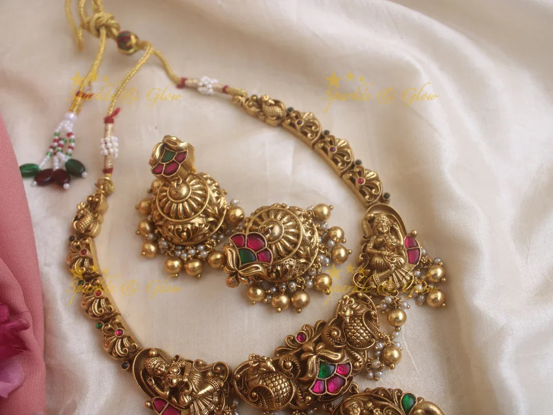 Statement Lakshmi and peacock carved jadau short necklace with red and green stones gold beads - Sparkle and Glow