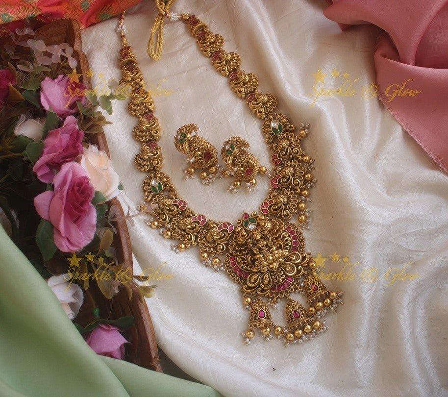 Grand Intricate gold alike Jadau Lakshmi and peacock carved long necklace with gold beads - Sparkle and Glow
