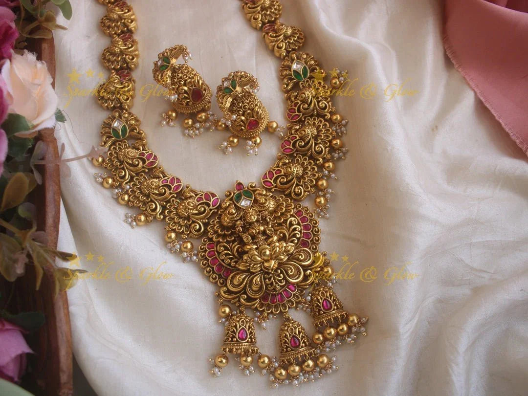 Grand Intricate gold alike Jadau Lakshmi and peacock carved long necklace with gold beads - Sparkle and Glow