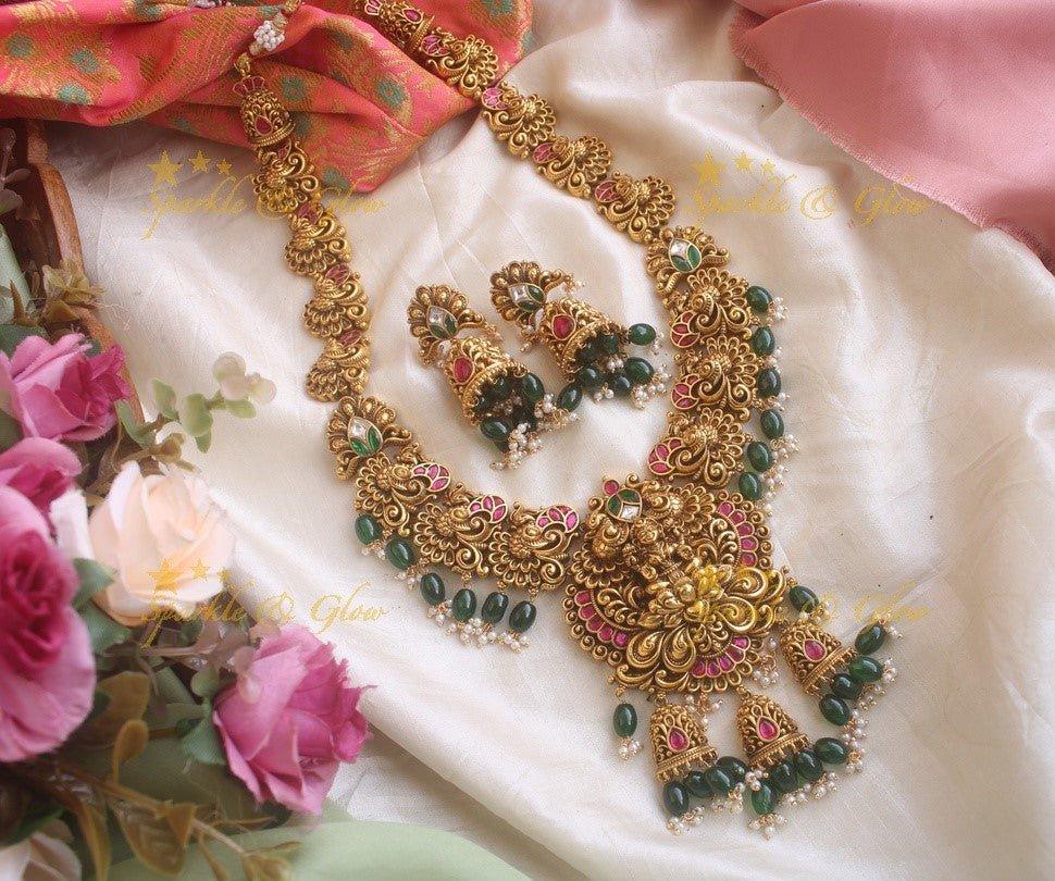 Grand Intricate gold alike Jadau Lakshmi and peacock carved long necklace with gold beads - Sparkle and Glow