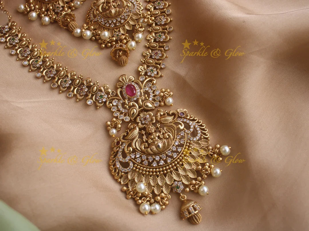 Stunning premium dull matte finish Lakshmi and peacock carved short necklace with cz stones and pearls - Sparkle and Glow