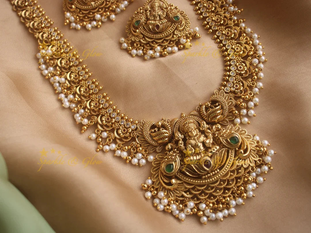 Stunning gold alike Lakshmi and peacock carved long gutta pusalu necklace with cz stones - Sparkle and Glow