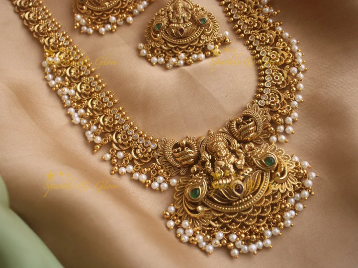 Stunning gold alike Lakshmi and peacock carved long gutta pusalu necklace with cz stones - Sparkle and Glow