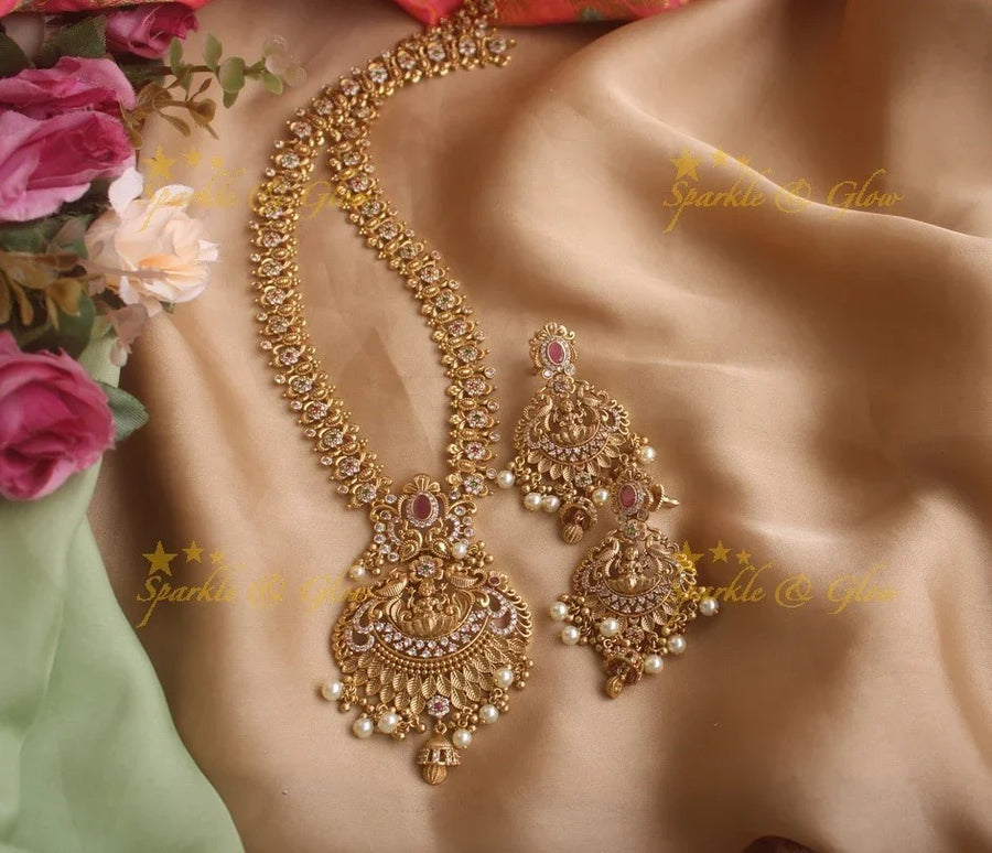 Stunning premium dull matte finish Lakshmi and peacock carved long necklace with stones and pearls - Sparkle and Glow