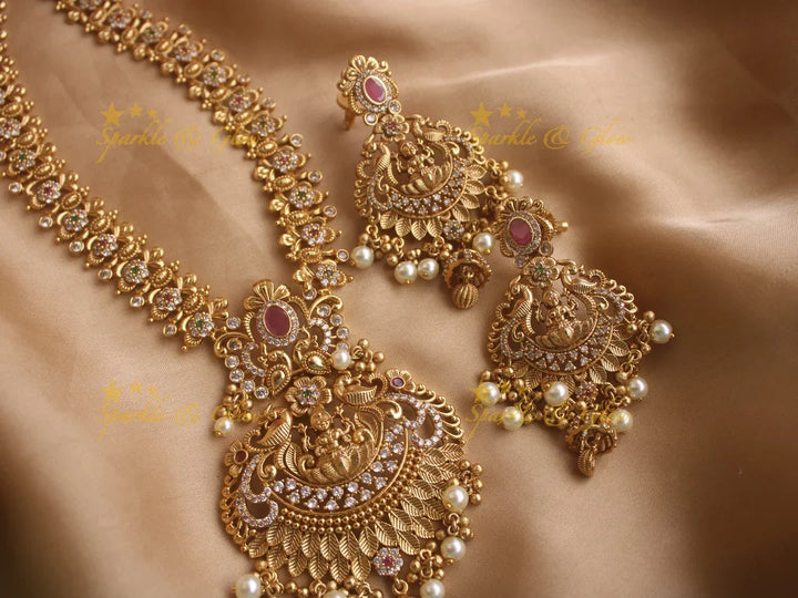 Stunning premium dull matte finish Lakshmi and peacock carved long necklace with stones and pearls - Sparkle and Glow