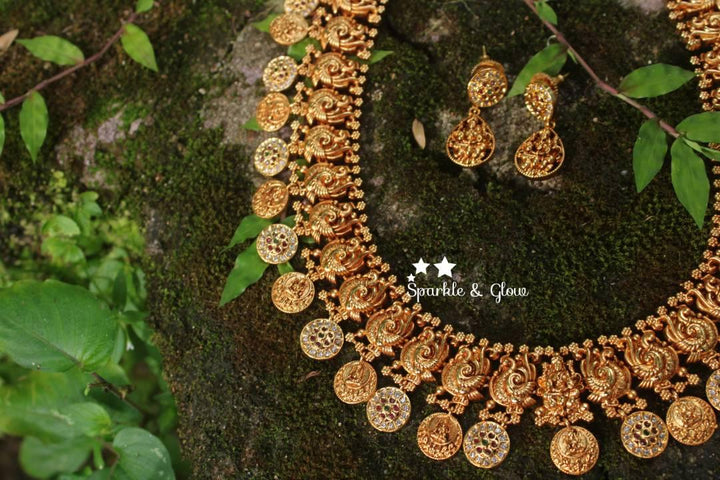 Gold alike polished peacock style lakshmi coin haram with stones - Sparkle and Glow