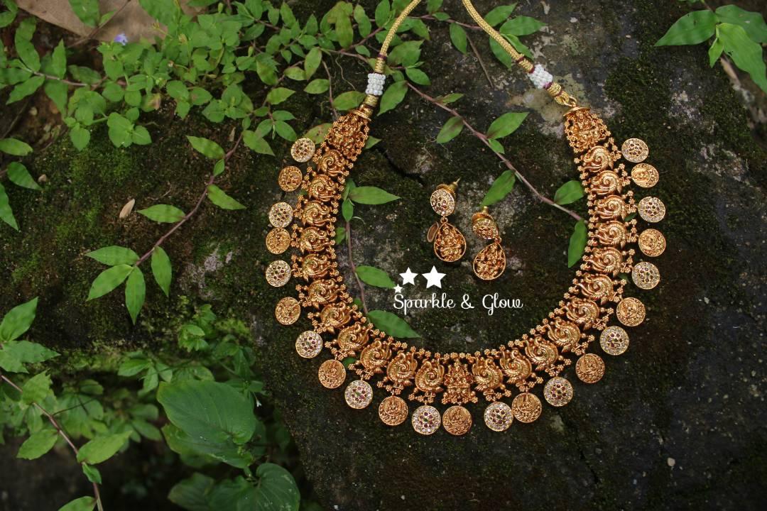 Gold alike polished peacock style lakshmi coin necklace with stones - Sparkle and Glow