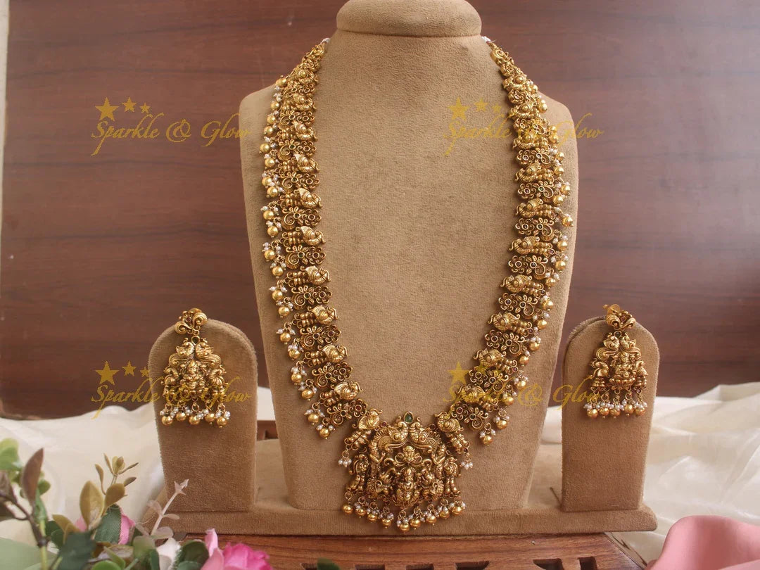 Grand Intricate Lakshmi Elephant and peacock carved Haram with red green stones and gold beads - Sparkle and Glow