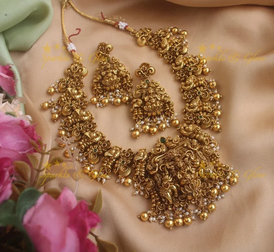 Exquisite Lakshmi Elephant and peacock carved short necklace with red green stones and gold beads - Sparkle and Glow