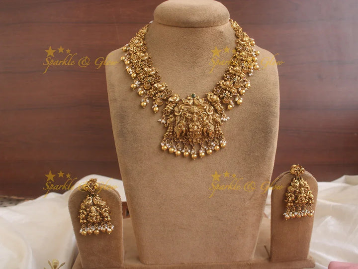 Exquisite Lakshmi Elephant and peacock carved short necklace with red green stones and gold beads - Sparkle and Glow