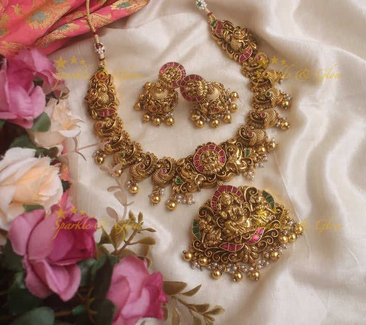 Exquisite Lotus and peacock carved jadau short necklace with pink and green stones and gold beads - Sparkle and Glow